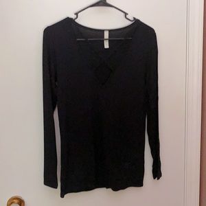 Black long sleeve with low neck. Size medium